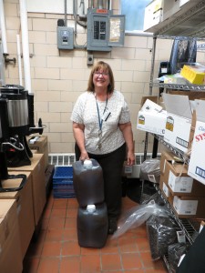 Nancy German, Dascomb Dining Hall manager at Oberlin College, bottling up WVO