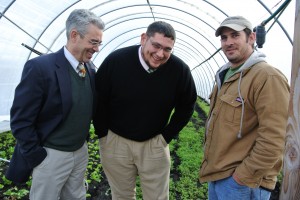 Resident District Manager Norman Zwagil, General Manager Ty Paup, and Farm Manager Alex Persful inside one of the greenhouses at Big City Farms