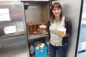 Urban Gleaners Program Coordinator Ava Mikolavich with soup donated from Lewis & Clark College.