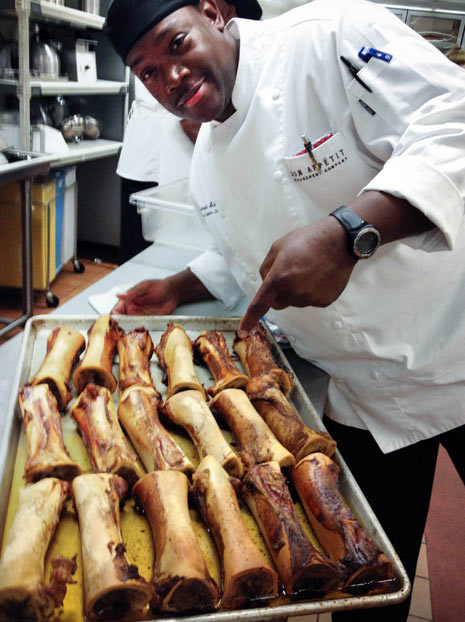 Chris shows off some bones roasted to make our from-scratch stock