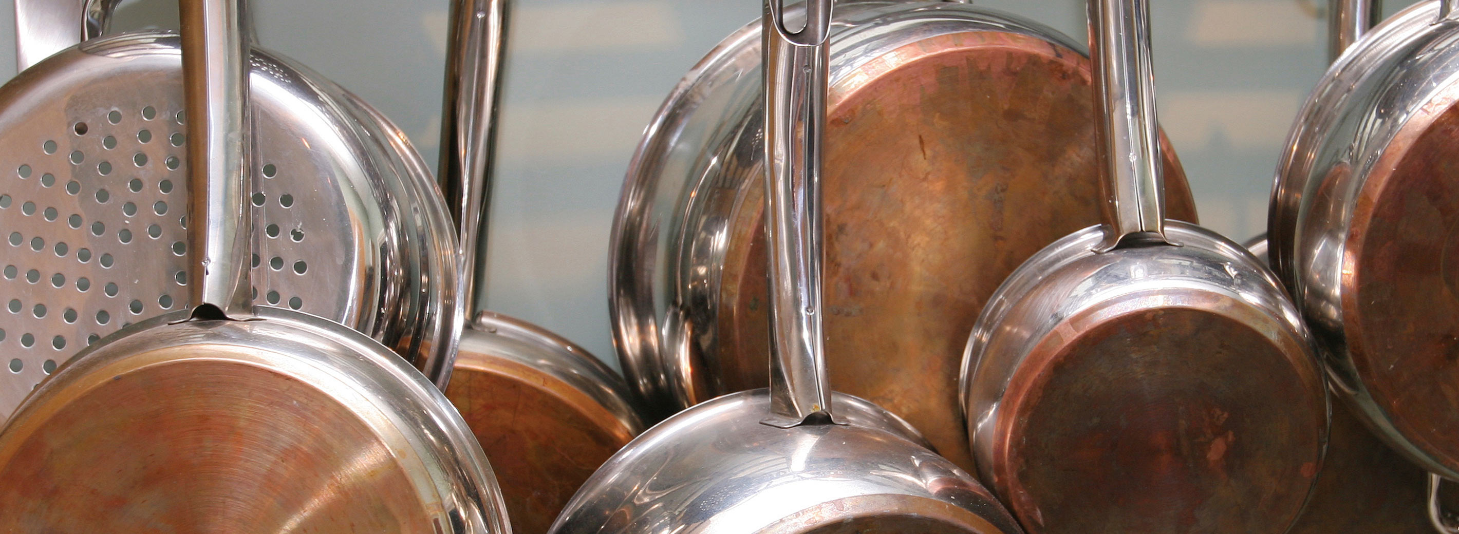 Copper pots and pans hanging