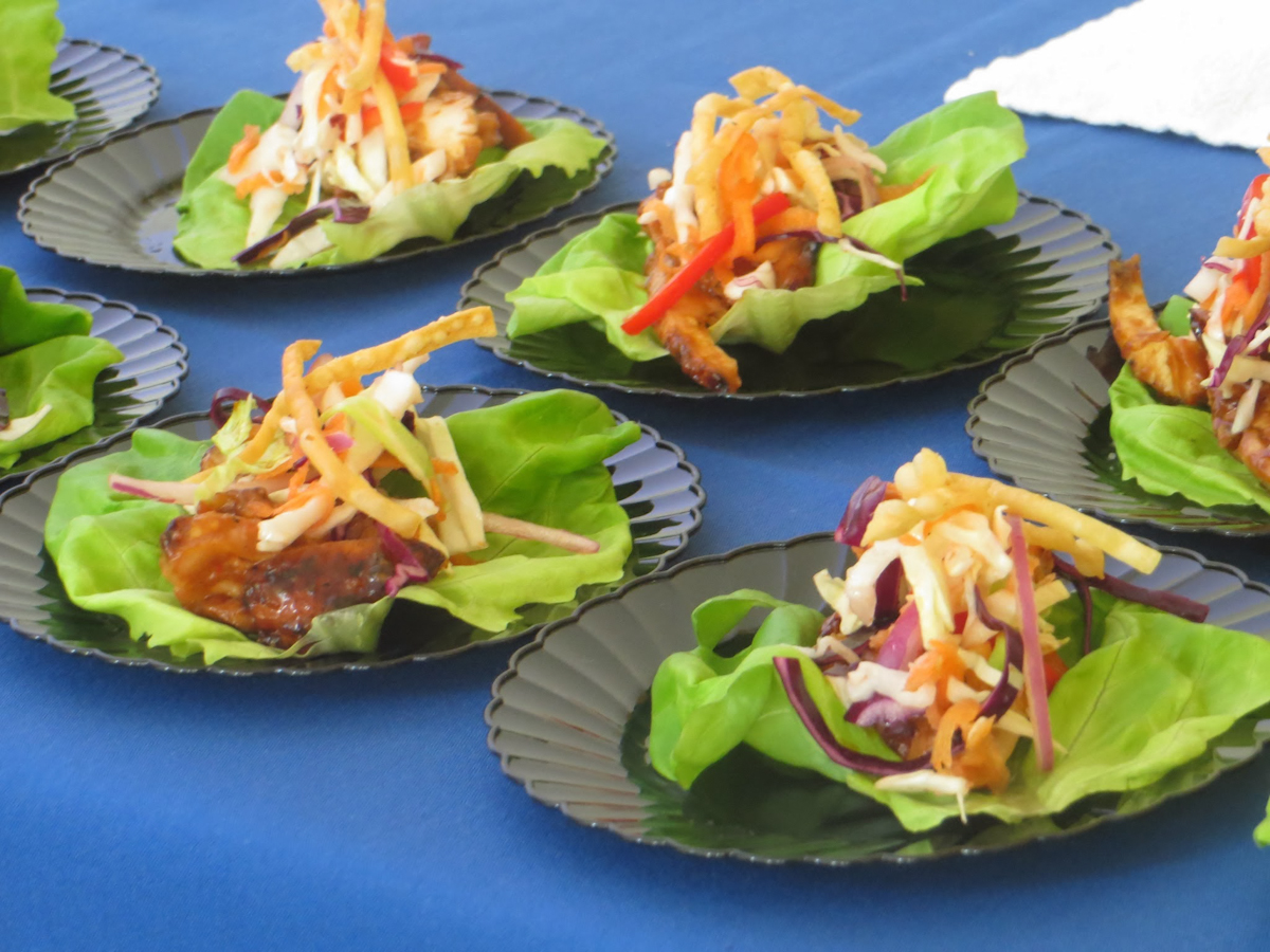 Thai chicken lettuce wraps with plum glaze and fresh vegetable slaw