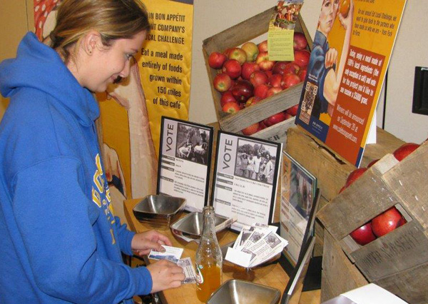 A Goucher College student votes on Eat Local Challenge Day.