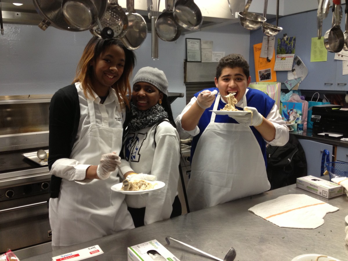 Students of St. Martin De Porres High School enjoy their made-from-scratch fettuccine Alfredo