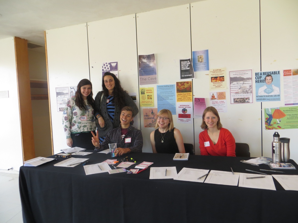 Just Food Summit student organizers assist with event  registration.