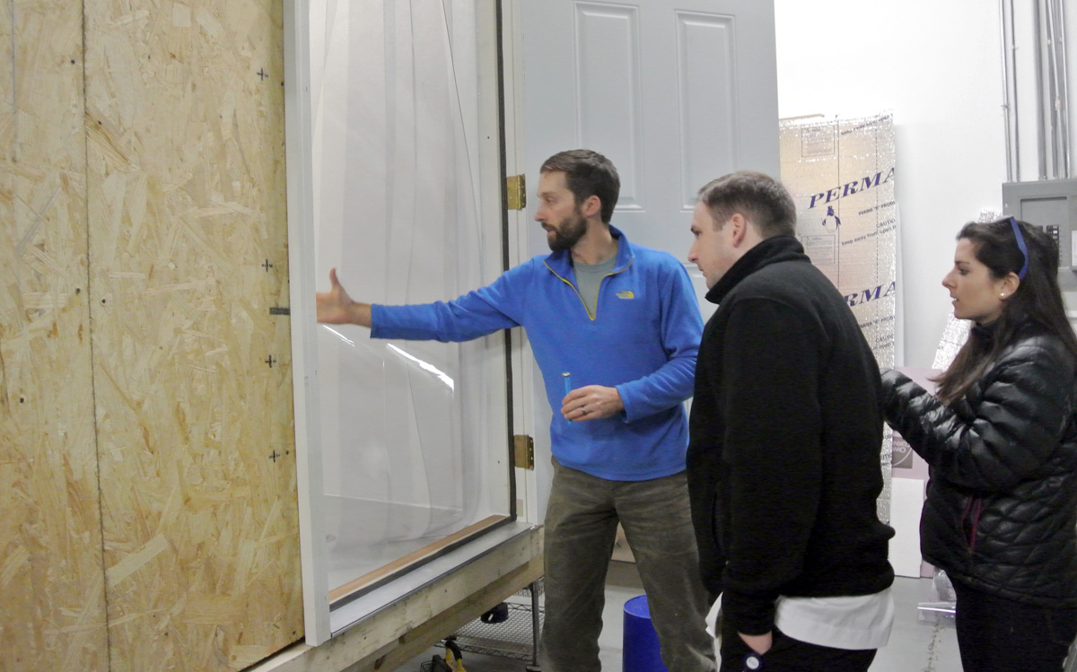 Ryan shows Bon Appétit @ SAS Executive Chef Dana Beaulieu and East Coast Fellow Sea Sloat the walk-in cooler he designed and built 