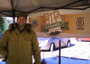 Rob selling salad mix at the farmers' market