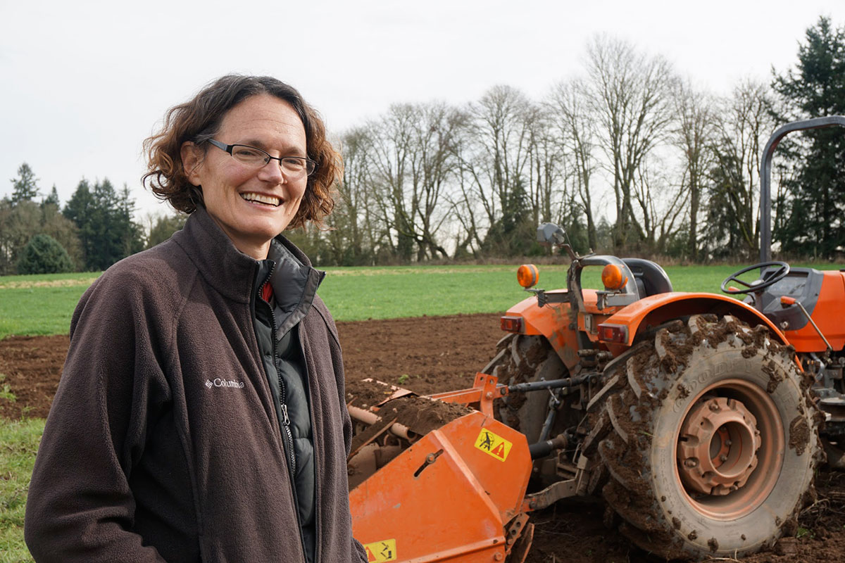 Shari with the farm's spader, which prepares the soil for planting (and preserves its integrity better than a traditional tiller)