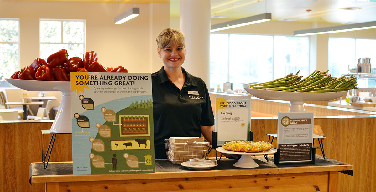 Malisia Wilkins, marketing coordinator and supervisor, at the University of Redlands' Earth Day table in the café