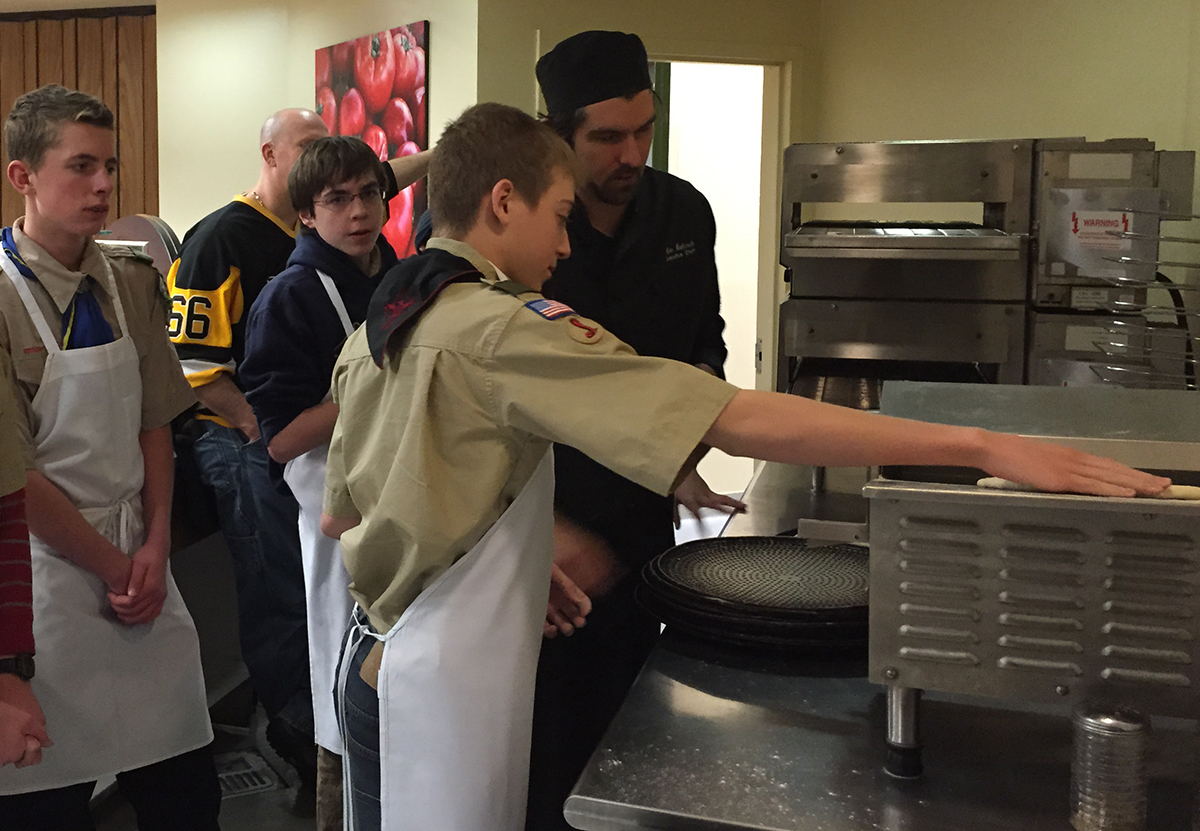 Executive Chef Glenn Babcock shows the troop how to make pizza from scratch