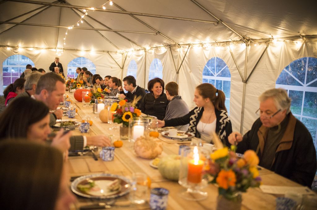 Parents, donors, and friends of St. Timothy's Shcool enjoy the family-style farm to table supper.  
