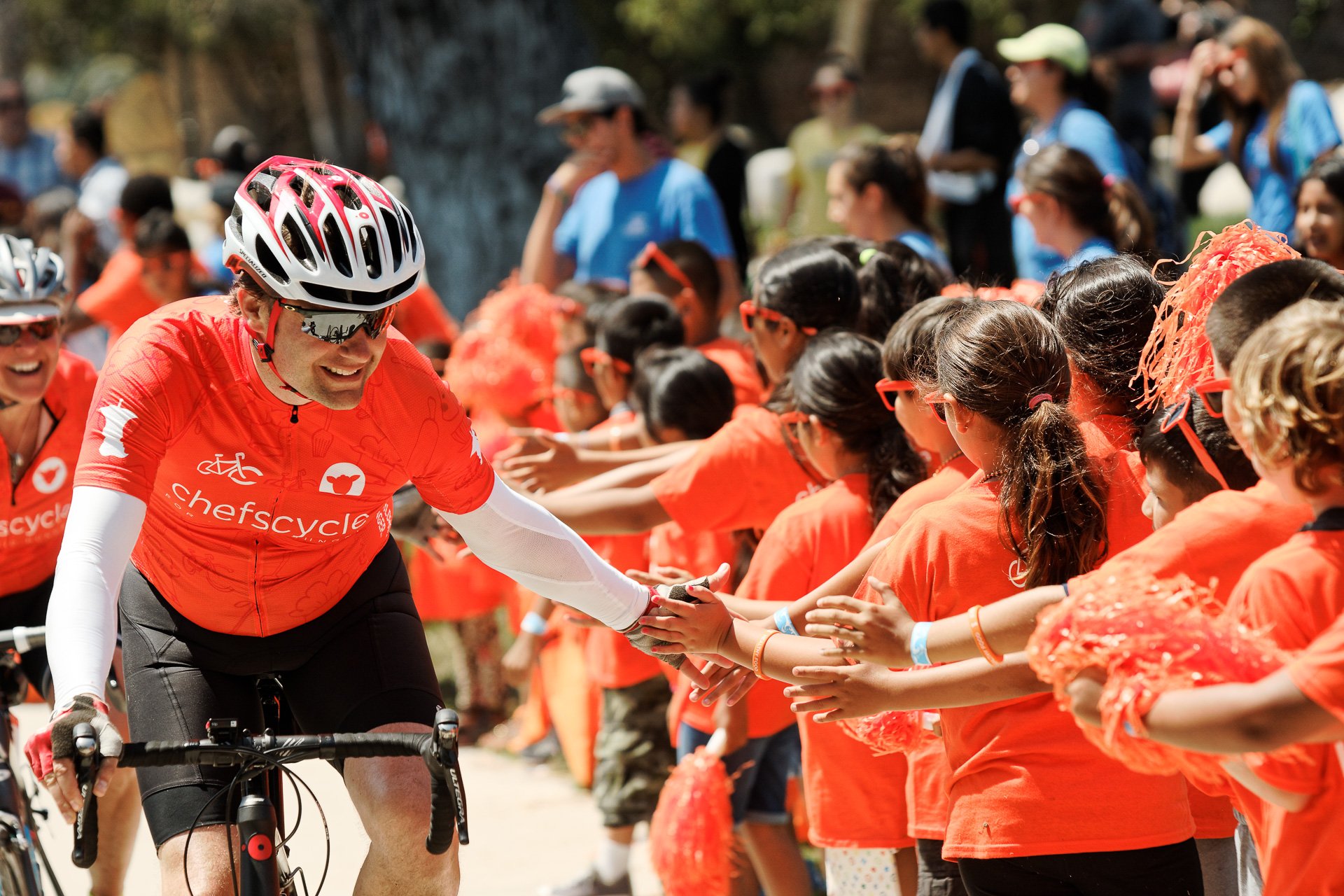 High-fives at the end of the race. (Photo by No Kid Hungry)