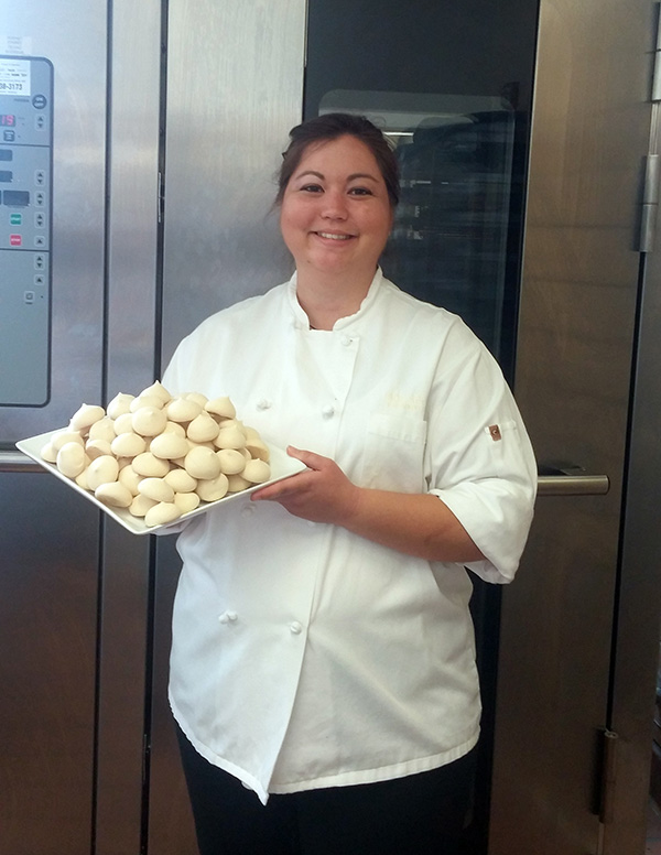 Beloit Pastry Chef Lisa Rau with a plate of her vegan meringues