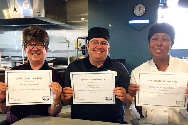 Grove City College Cashier Cheryl Scheidhauer, Lead Café Supervisor and Safety Champion Peggy Ice, and Hicks Café Chef Sheila Jackson-Harden show off their FARECheck certificates