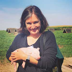 Woman holding piglet