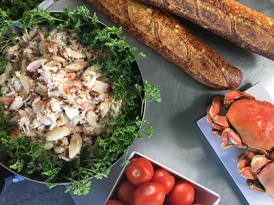 Fresh Dungeness crab, tomatoes, and sourdough bread