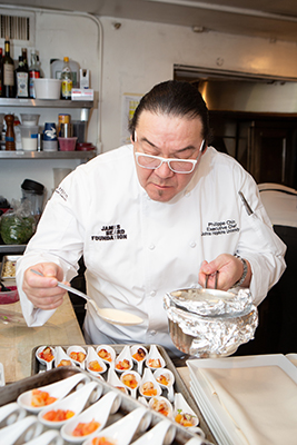 Campus Executive Chef Philippe Chin helps plate the hors d’oeuvres 