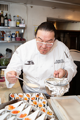 Campus Executive Chef Philippe Chin helps plate the hors d’oeuvres