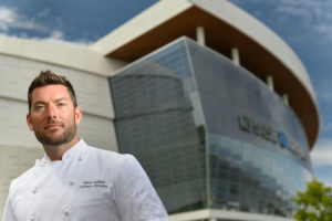 Chef in front of Chase Center