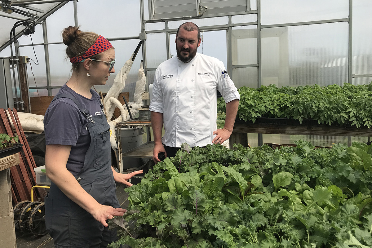 Garden Manager Candace Minster shows Rose-Hulman Executive Chef Justin Durand around the greenhouse