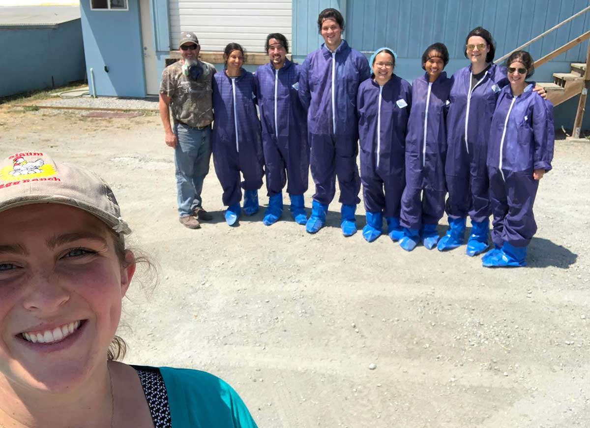 Group of people in purple suits