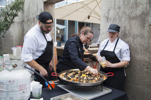 Café Modern team prepares paella