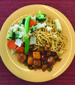 The lo mein noodle plate features an assortment of colorful vegetables