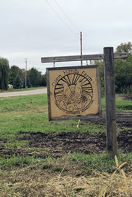 Sign welcoming visitors to Open Hands Farm