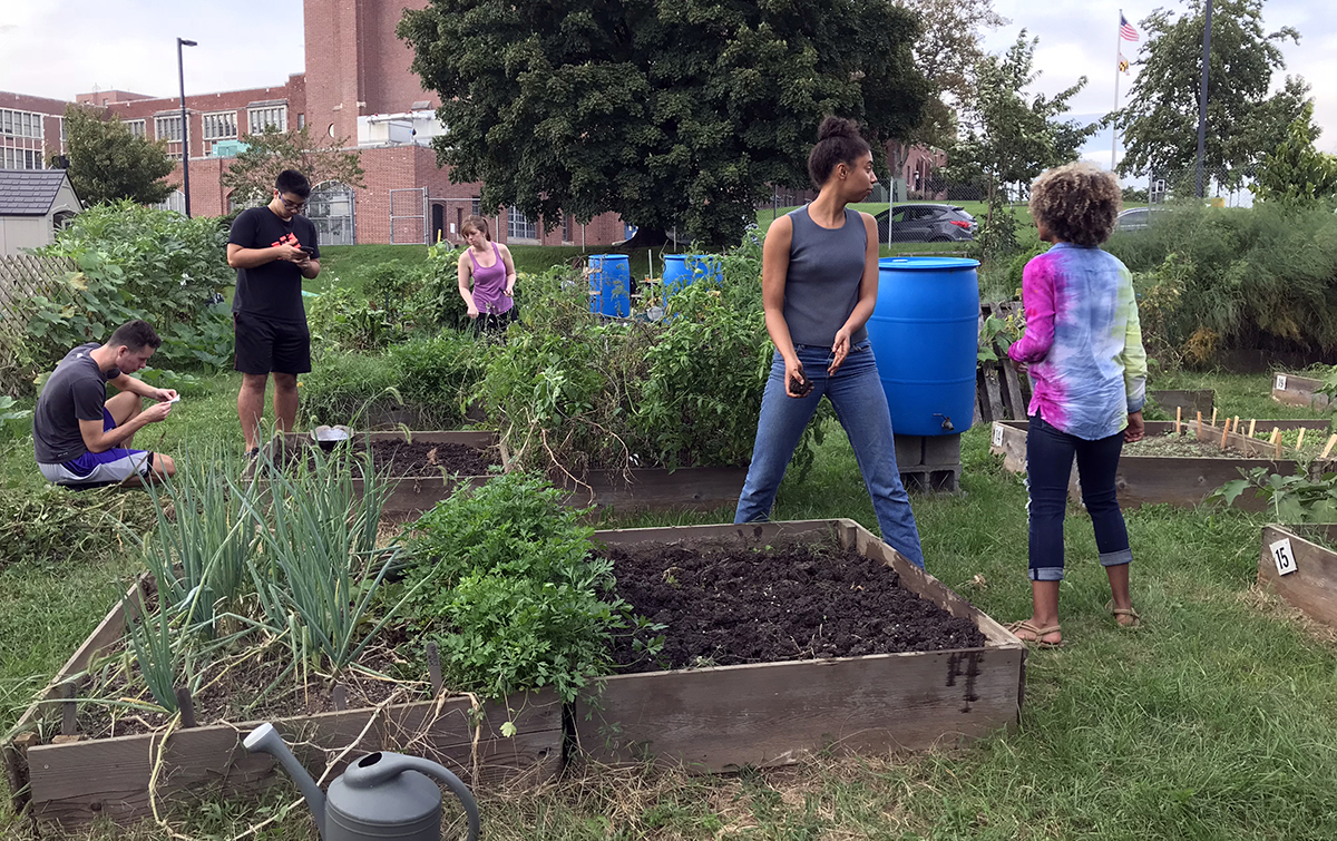 Hopkins students, staff, and community members work at the Blue Jay’s Perch Community Garden