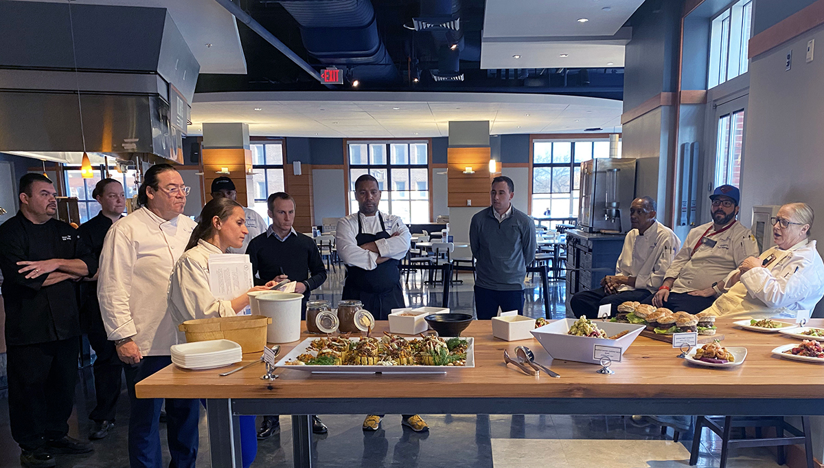 Chefs presenting their dishes to the judges