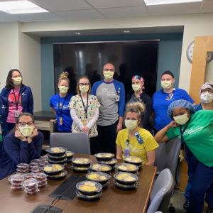 Hosipital staff in masks with lunch
