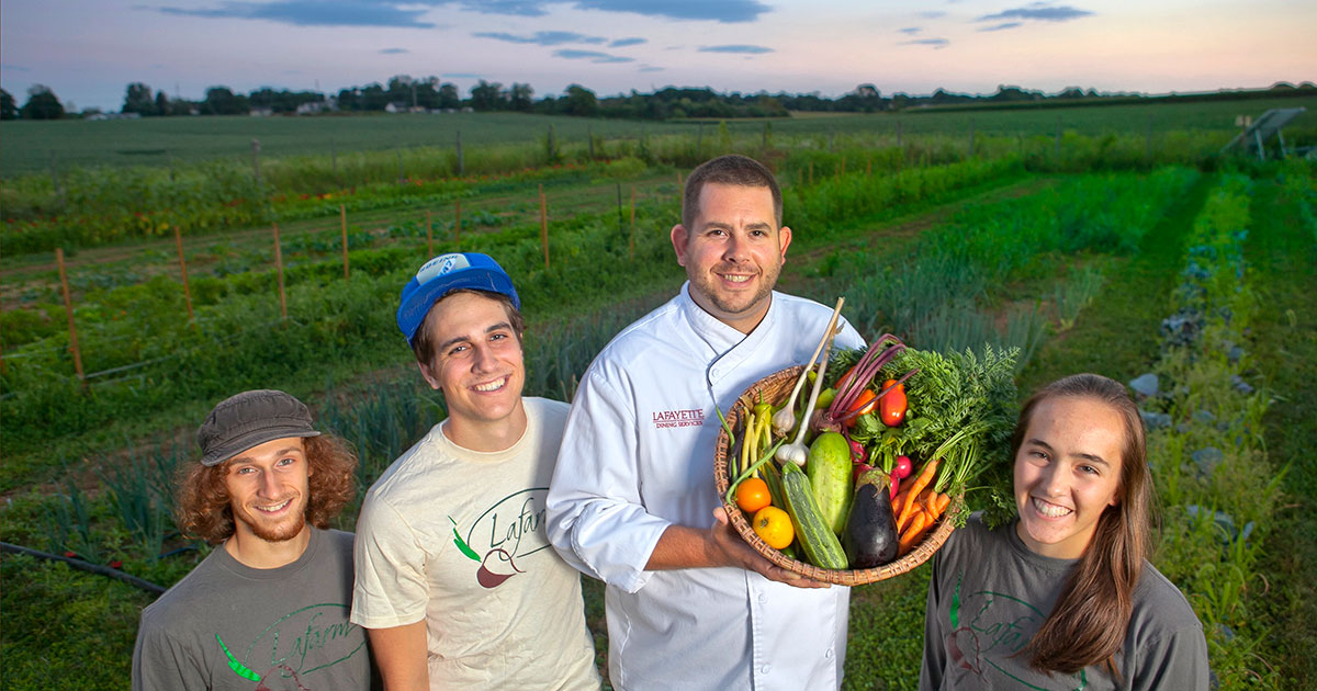 Chef and students in field