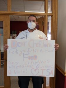 Chef holding thank you sign