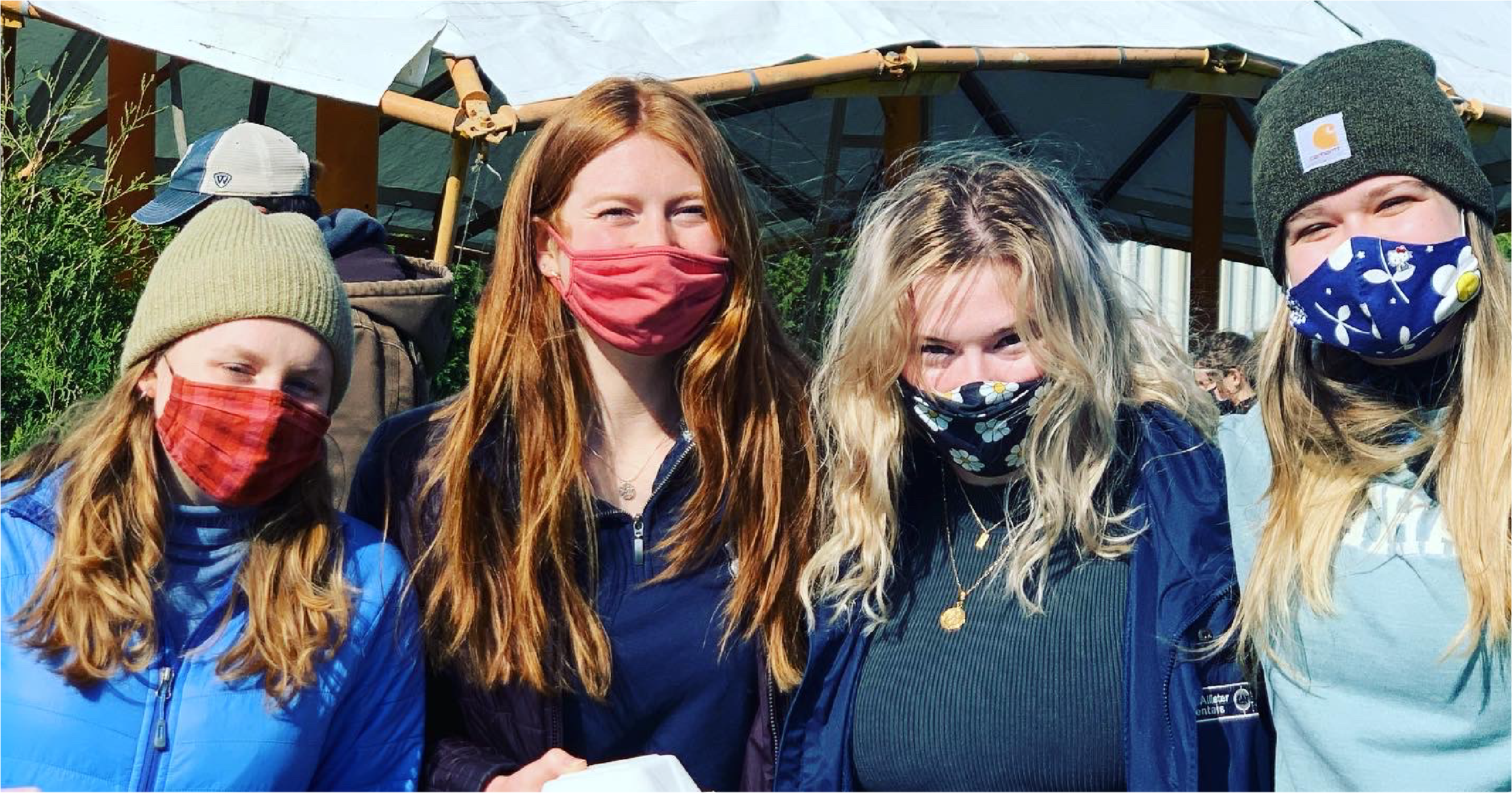 Butler students "smizing" after receiving their plant-based bowls