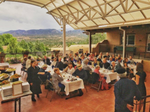 Guido and Nina speak to a room of people about to enjoy a local farm dinner