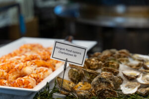 lobster tail and oysters on a raw bar