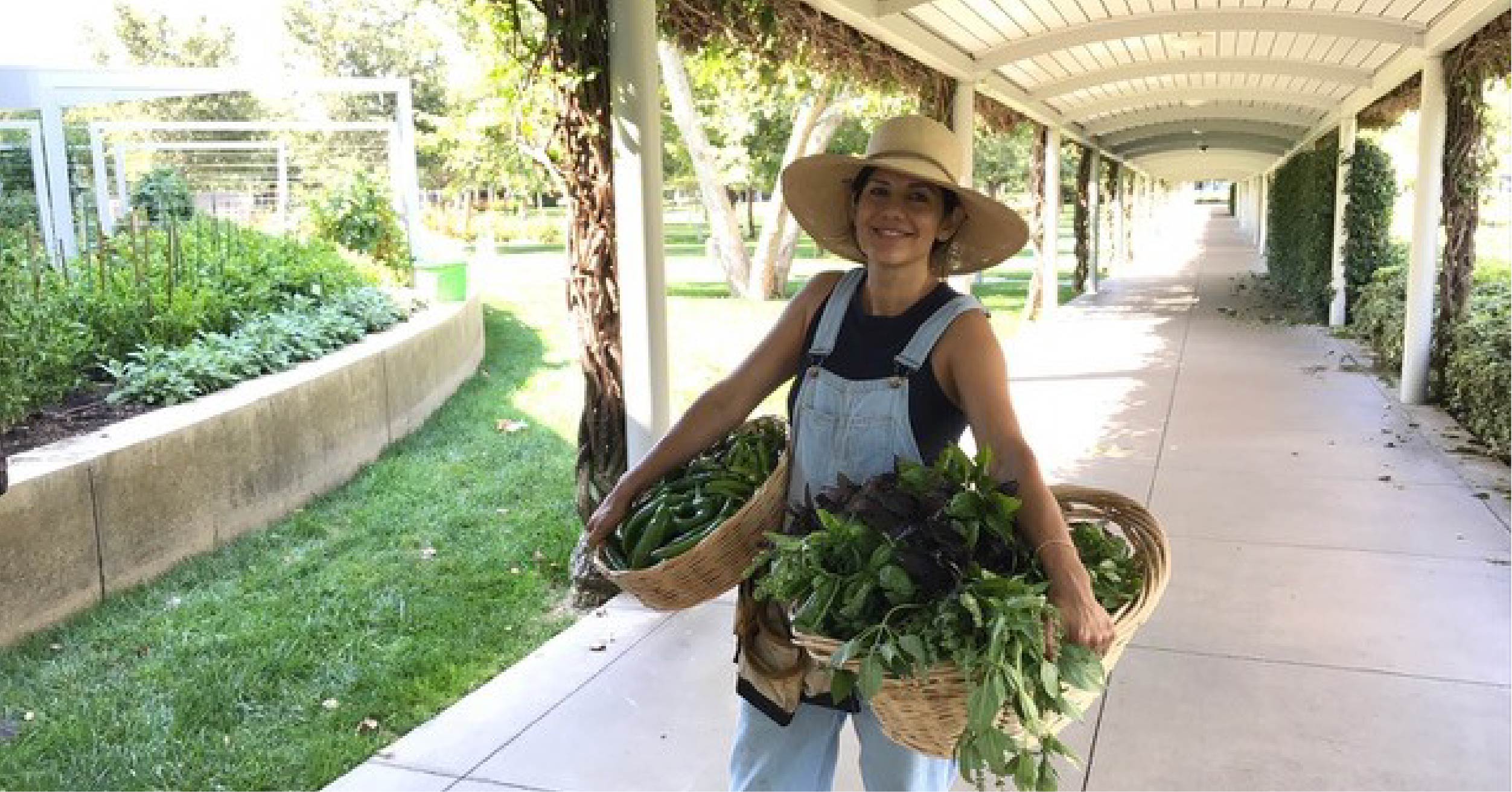 Emy Terusa of Tenfold Harvest poses with a bounty of produce grown in Capital Group’s on-site garden in Irvine, CA. A close relationship between Capital Group, Tenfold Harvest, and Bon Appétit brings hyperlocal produce to the menus at Capital Group’s on-site café throughout the year.