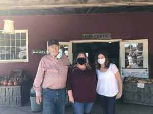 Matt poses with Bon Appétit at Emmanuel College General Manager Robin Furtado (center) and Robin's sister (right) in from of the Horse Listeners farm store