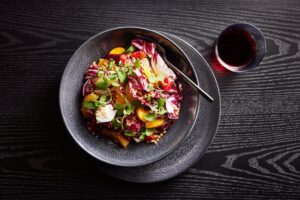 A vibrant bowl of farro, citrus and greens