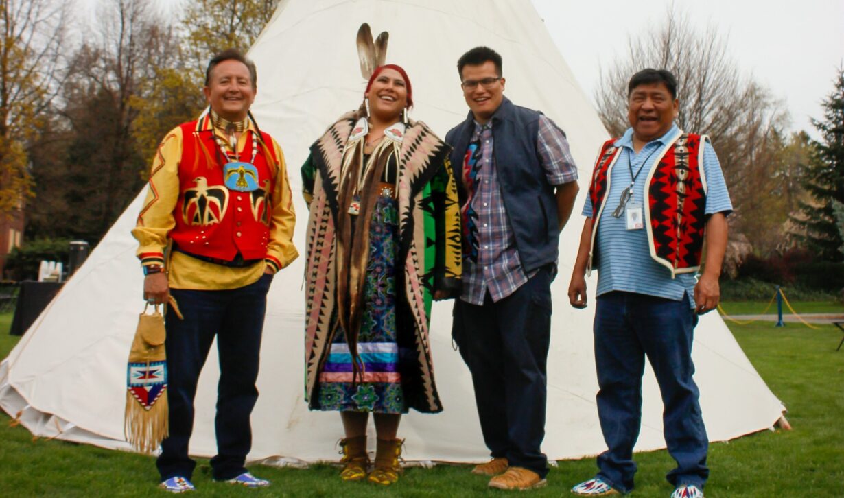 Indigenous members of the plateau tribes pose together at Whitman