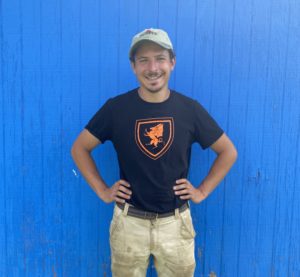 Josh poses in front of one of LaFarm's tool sheds