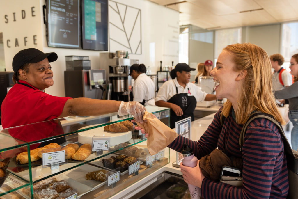 A student at Washington University in St. Louis grabs a pastry from the school’s award-winning Parkside Café 