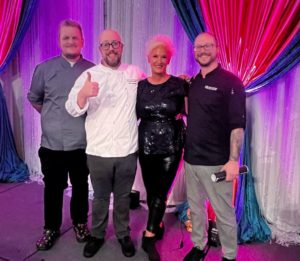  Bon Appétit at Whitman College Executive Chef Jon Sodini, Bon Appétit at Saint Martin’s Executive Chef Matthew Alspaugh, and Adobe Seattle Executive Chef Aaron Senter pose with Anne Burrell