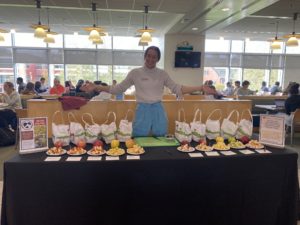 Elise shows off 10 varieties of Horse Listeners’ apples at Roger Williams University.