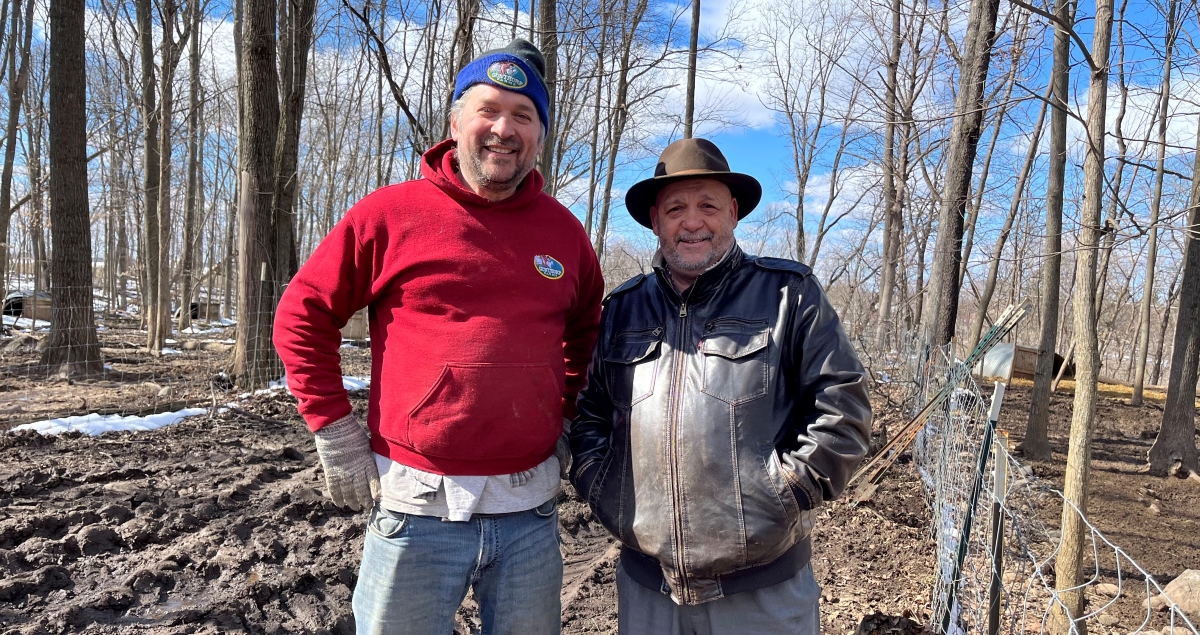 Farmer Greg Gunthorp poses with Bon Appétit at Trine University General Manager Joe Gentile  