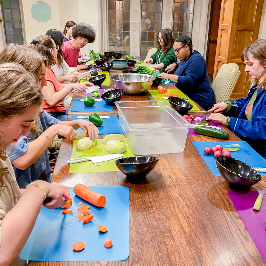 Rhodes College Sustainability Coalition, Beekeeping Club, and Roots Campus Garden members slice up ingredients