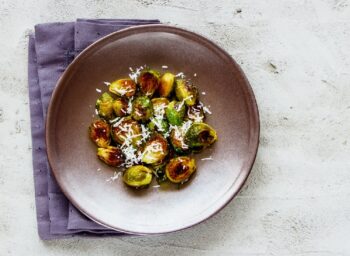 Charred Brussels Sprouts with Crisp Anchovies, Asiago, and Roasted Garlic