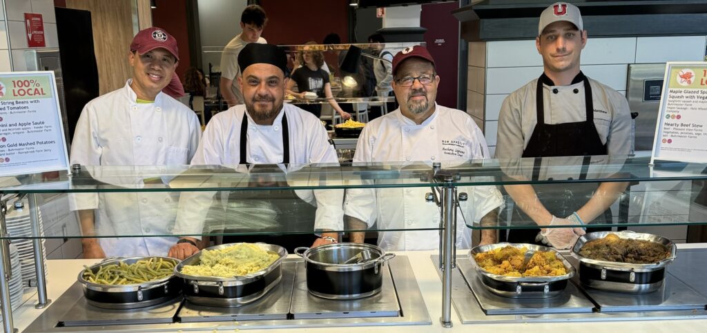Four chefs from Union College in Schenectady, NY behind the line