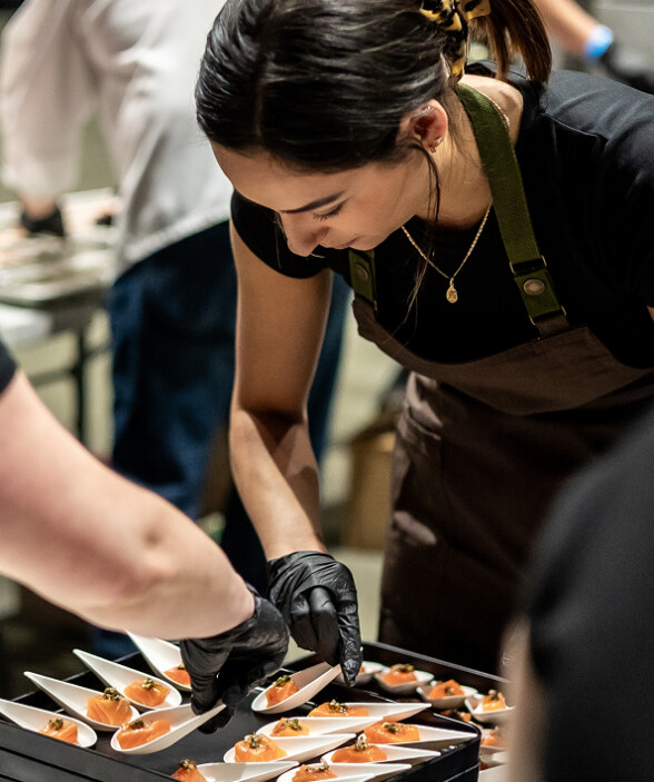 female chef arranging appetizers