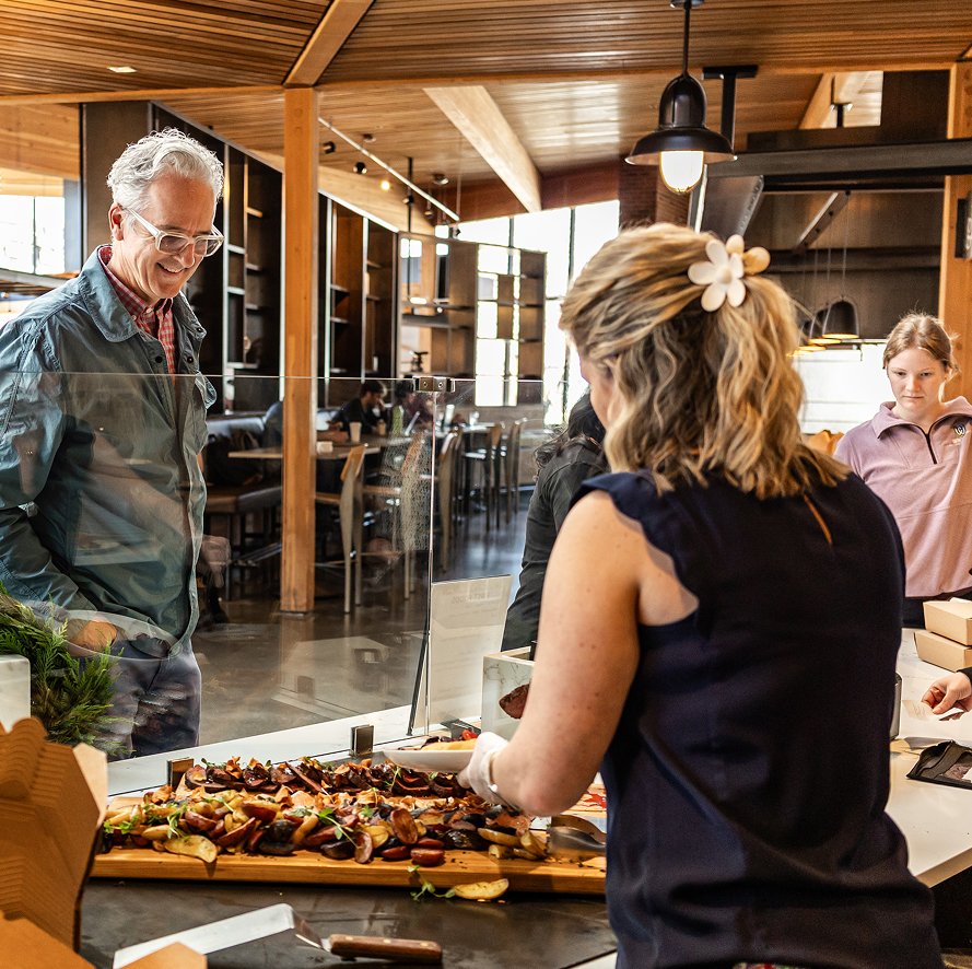 student serving parent at college